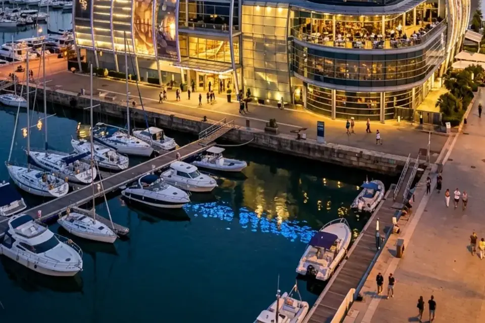 Marina berths and waterfront promenade at Port Olimpic, Barcelona (illustrative image)